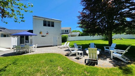 E. Sandwich Beach Cape Cod vacation rental - Large private backyard with fire pit and outdoor hot shower