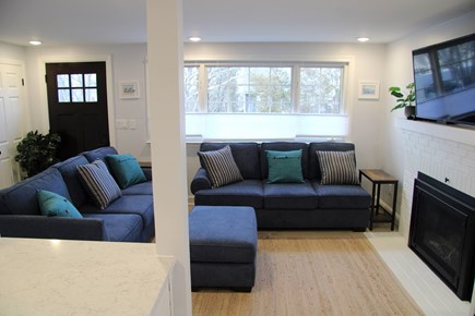 E. Sandwich Beach Cape Cod vacation rental - Living room with big screen smart T.V., fireplace, pullout sofa