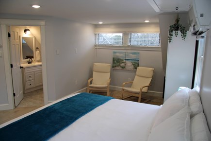 E. Sandwich Beach Cape Cod vacation rental - King primary bedroom upstairs with large screen smart T.V.