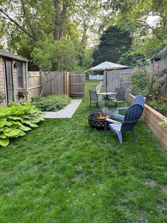 South Orleans Cape Cod vacation rental - Private Front Yard with Table and Fire Pit.