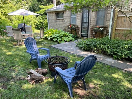 South Orleans Cape Cod vacation rental - Front Yard of Cottage, with Table, Grille, and Fire Pit
