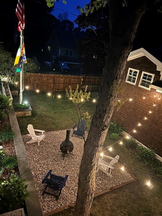 Onset Heights MA vacation rental - Fire Pit Area at night, Large fenced rear yard