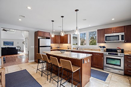 Eastham Cape Cod vacation rental - Bright, inviting kitchen with exterior access to pool and patio