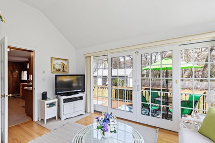 Dennis Cape Cod vacation rental - A bright space with a TV and direct access to the back deck