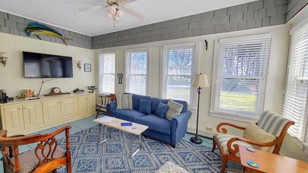 Falmouth Cape Cod vacation rental - Sunroom with comfortable furniture and large flat screen TV