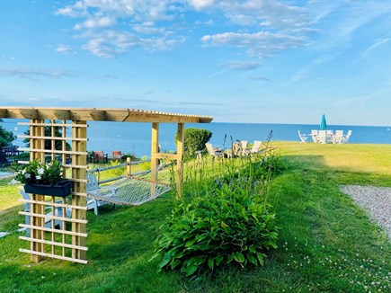 Manomet, Plymouth Manomet vacation rental - View of the side yard with hammock and fire pit