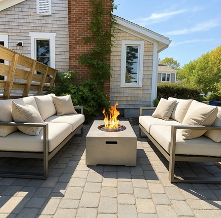 Harwich Cape Cod vacation rental - Patio with fire pit and fountain.