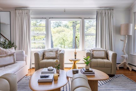 Harwich Cape Cod vacation rental - Open concept LR with RH “Cloud” couch & leather swivel chairs.