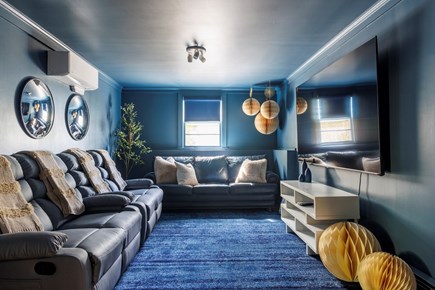 Harwich Cape Cod vacation rental - Media room with reclining love seats, 85”TV & attached 1/2 bath.