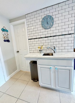 West Dennis Cape Cod vacation rental - Kitchen and door to the bathroom.