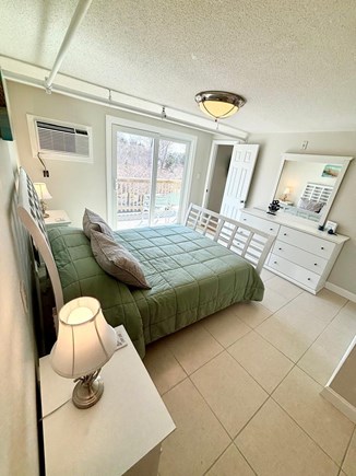 West Dennis Cape Cod vacation rental - Bedroom with queen size bed and sliders out to deck.