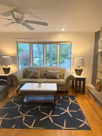 Falmouth, New Silver Beach Cape Cod vacation rental - Comfy living room w fireplace, new rugs, picture window