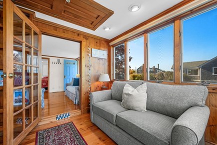 Sandwich Cape Cod vacation rental - Sunroom area, couch turns into a full size pull out bed