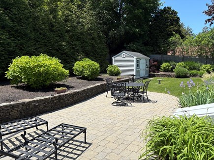 Centerville Cape Cod vacation rental - Patio with a grill and umbrella patio set