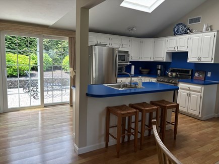 Centerville Cape Cod vacation rental - Kitchen island and slider to patio