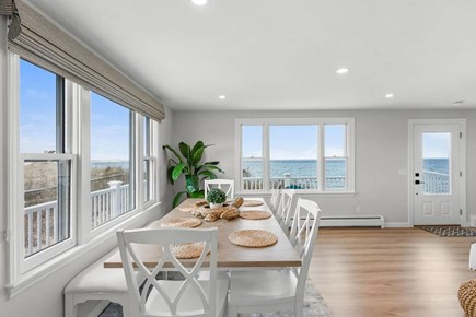 East Sandwich Cape Cod vacation rental - Dining table with views of the water and deck