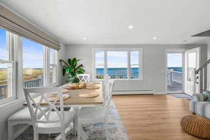 East Sandwich Cape Cod vacation rental - Dining table with views of the water and deck