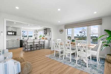 East Sandwich Cape Cod vacation rental - Dining area with seating for 8 people and kitchen island with additional seating