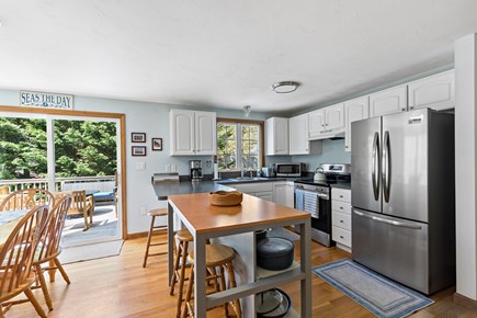 Brewster Cape Cod vacation rental - An updated kitchen boasting a kitchen island with bar stool seats