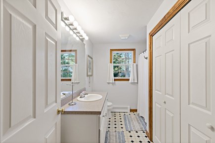 Brewster Cape Cod vacation rental - Main floor bathroom with a bathtub and shower