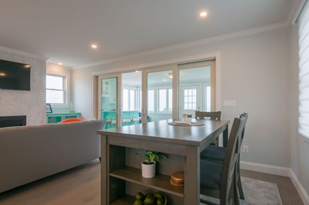 East Sandwich Cape Cod vacation rental - Dining area with access to the sunroom off of the living area.