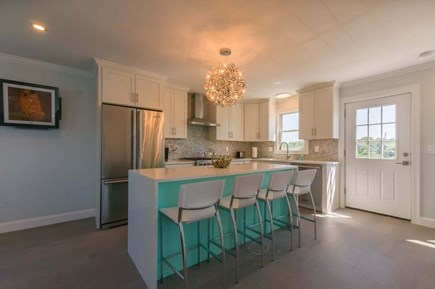 East Sandwich Cape Cod vacation rental - Fully updated kitchen with stainless steal appliances, and island that that seats four guests.
