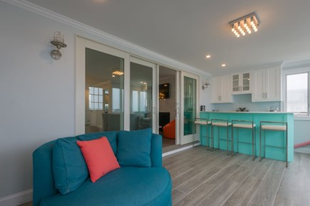 East Sandwich Cape Cod vacation rental - Sunroom with bar and seating off of the living/dining area.