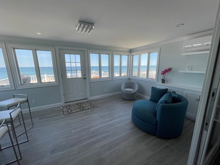 East Sandwich Cape Cod vacation rental - Extra seating in sunroom and ocean views.