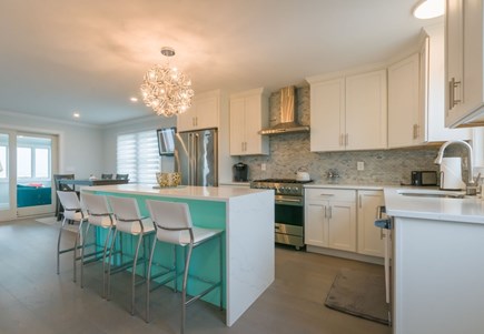 East Sandwich Cape Cod vacation rental - Large updated kitchen with an island and seating for four guests.