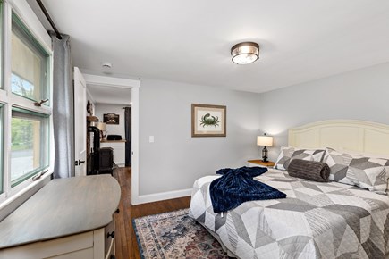 Orleans Cape Cod vacation rental - The main-level primary bedroom features a queen bed.