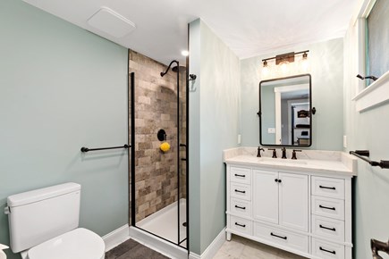 Orleans Cape Cod vacation rental - The primary bedroom boasts an ensuite bathroom with a shower