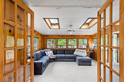 Orleans Cape Cod vacation rental - Double doors lead to a sunlit wood-paneled sunroom
