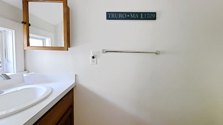 Truro Cape Cod vacation rental - Ensuite half bathroom in bedroom with two twins