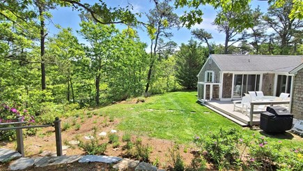 Truro Cape Cod vacation rental - Back deck with backyard and wooded view
