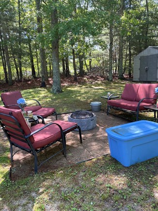 East Falmouth Cape Cod vacation rental - Cozy backyard fire pit with seating for 4