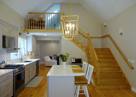 Pocasset, Monument Beach Cape Cod vacation rental - Kitchen staircase leads to queen bedroom, bonus rooms