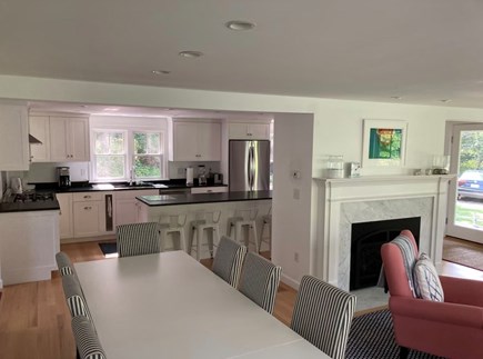 Falmouth, Sippewissett Cottage Cape Cod vacation rental - Dining and kitchen with fireplace in LR