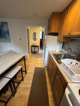 Provincetown Cape Cod vacation rental - Cute kitchen with stove, microwave and table for two.