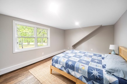 Yarmouth Cape Cod vacation rental - Inviting second bedroom with soft light and coastal charm
