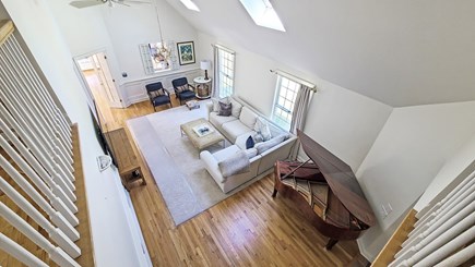 Wellfleet Cape Cod vacation rental - Vaulted living room with comfortable seating, TV & piano