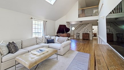 Wellfleet Cape Cod vacation rental - Vaulted living room with comfortable seating, TV & piano
