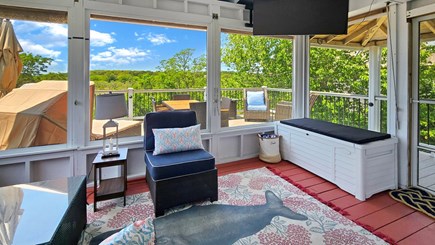 Wellfleet Cape Cod vacation rental - Wonderful screen porch with seating and large TV
