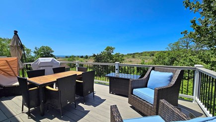 Wellfleet Cape Cod vacation rental - Deck has a table, grill, fire table, chaise lounges and seating