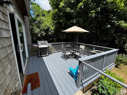 Eastham Cape Cod vacation rental - Enjoy time on the deck with a propane grill and fire pit table.