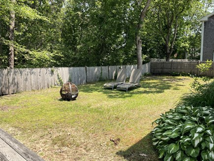 Harwich, Walk to Beach Cape Cod vacation rental - Fenced in back yard and firepit
