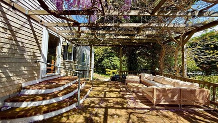 Chatham Cape Cod vacation rental - Sip, lounge, or nap beneath the wisteria-draped pergola.