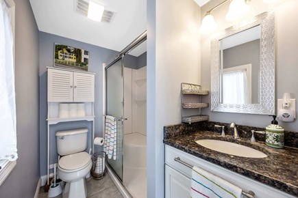 Bourne, Buzzards Bay Cape Cod vacation rental - Modern washroom with seamless storage solutions.