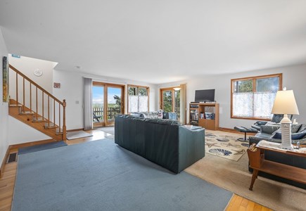 Harwich Cape Cod vacation rental - Living area on first floor with sliders out to first level deck