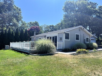 Bourne, Buzzards Bay Cape Cod vacation rental - Deck with pond views has a dining table and hot tub