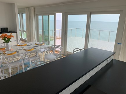 Truro Cape Cod vacation rental - The oversized dining table is adjacent to the kitchen!